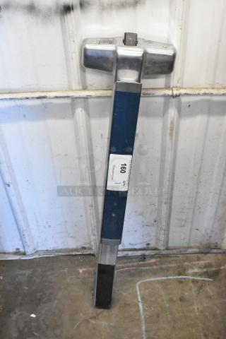 Metal door push bar with blue and silver finish, in used condition. Visible ID label with "160 QTY."
