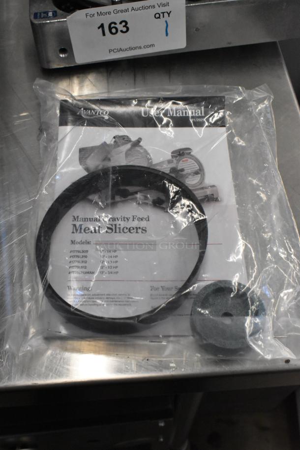 Avantco 177SL512 stainless steel meat slicer with blade sharpener, 115 volts, 1 phase. Includes manual and accessories.