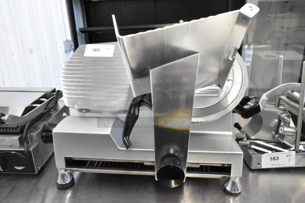 Avantco 177SL512 stainless steel meat slicer with blade sharpener, 115V, 1-phase, excellent condition, visible auction tag.