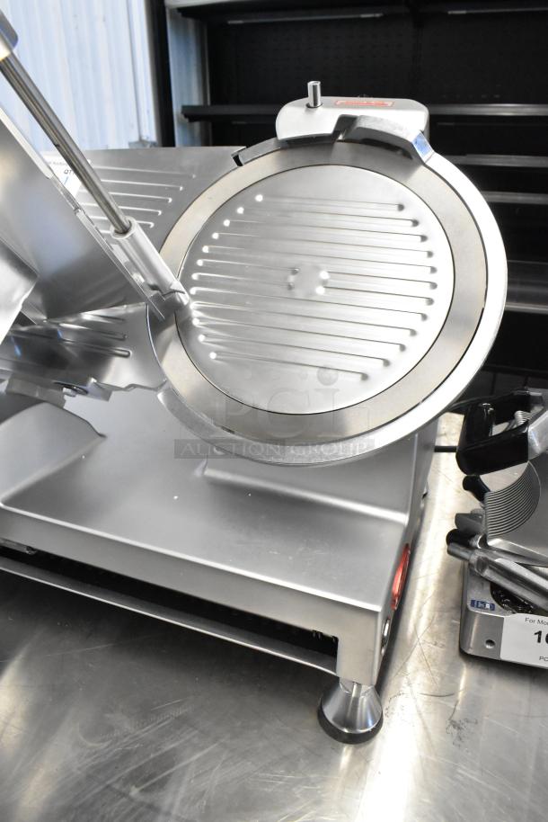 Avantco 177SL512 stainless steel commercial meat slicer with blade sharpener; shows sharp blade and sturdy base; 115 volts.