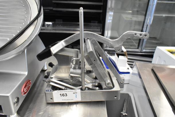 Choice 407ONSLIC316 metal commercial countertop lettuce head cutter; sturdy design, excellent condition, auction label visible.