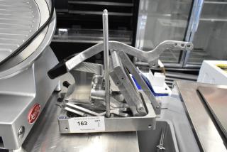 Choice 407ONSLIC316 metal commercial countertop lettuce head cutter; sturdy design, excellent condition, auction label visible.