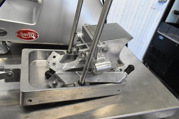 Choice 407ONSLIC316 metal commercial countertop lettuce head cutter on stainless steel surface, features durable construction.