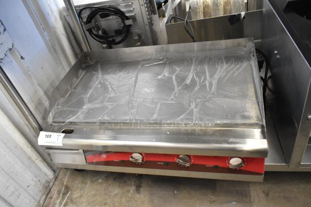 Brand new Avantco 30" flat top griddle with minor scratches, stainless steel, commercial use, three controls visible.