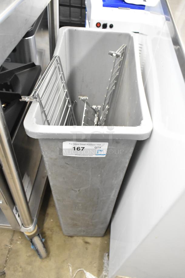 Gray Poly Slim Jim Trash Can containing metal racks, good condition, sticker with auction details on front.