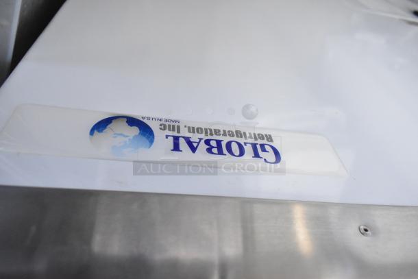 Global Metal Commercial Chest Freezer, shown with lid and brand label. Features commercial casters for mobility.