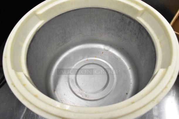 Thunder Group SEJ-20000 rice cooker with stainless steel interior. Used condition, 115V, 1 phase. Visible wear inside.