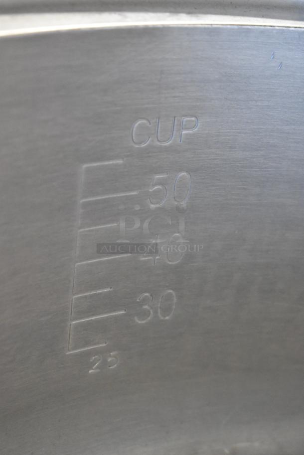 Rinnai RER-55AS-N rice cooker with 25 to 50 cup measurement markings on inner metal wall.