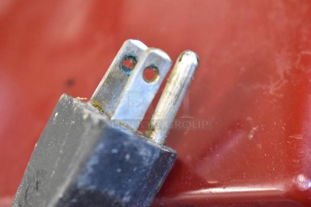 Power plug of Robot Coupe R2N food processor. Visible wear, 120 volts, 1 phase. Metal casing in the background.