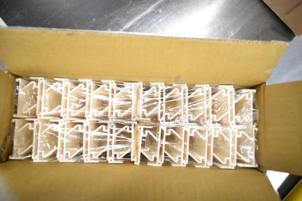 8 boxes of 40 Acme 011120313 food case pricer clip sign holders, brand new in packaging, shown inside an open cardboard box.