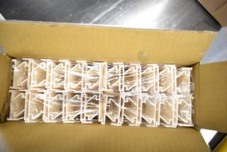 8 boxes of 40 Acme 011120313 food case pricer clip sign holders, brand new in packaging, shown inside an open cardboard box.