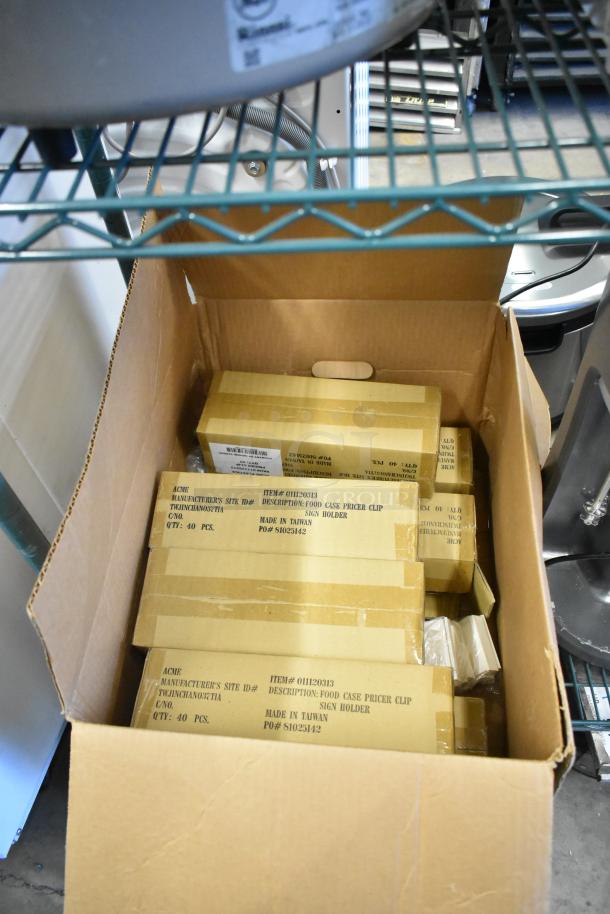 8 new boxes of Acme 011120313 Food Case Pricer Clip Sign Holders, 40 pcs each. Made in Taiwan.