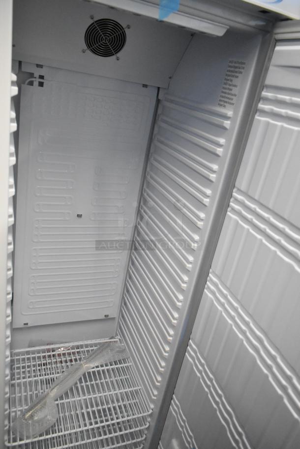 Brand new KoolMore KM-RMD12WH single door reach-in cooler, 115V, metal interior with shelving, minor cosmetic blemishes.