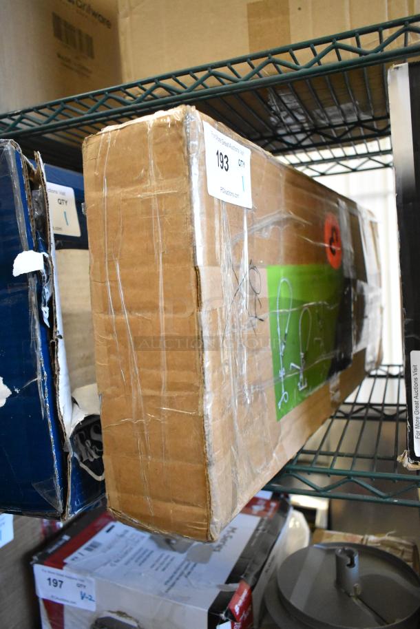 Cardboard box labeled "T&S Faucet w/ Spray Nozzle," condition noted as scratch and dent, sealed with tape, on shelf.