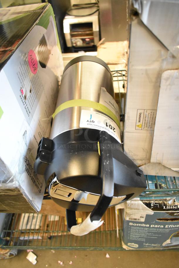 BRAND NEW SCRATCH AND DENT! Fetco 344D063 3.8L stainless steel airpot with lever, visible handle, slight damages noted.