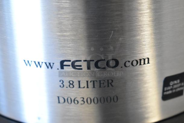 Brand new Fetco 344D063 3.8-liter stainless steel lined airpot. Visible branding and model number on the surface.