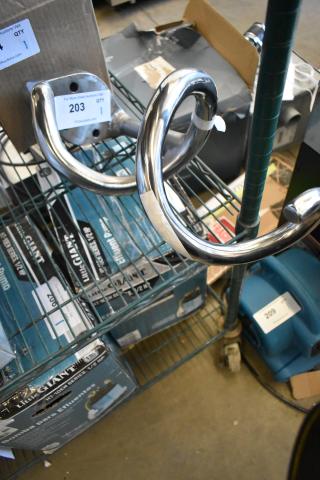 Brand new metal dough hook attachment with minor scratches; shiny finish, sturdy construction, auction item tag visible.