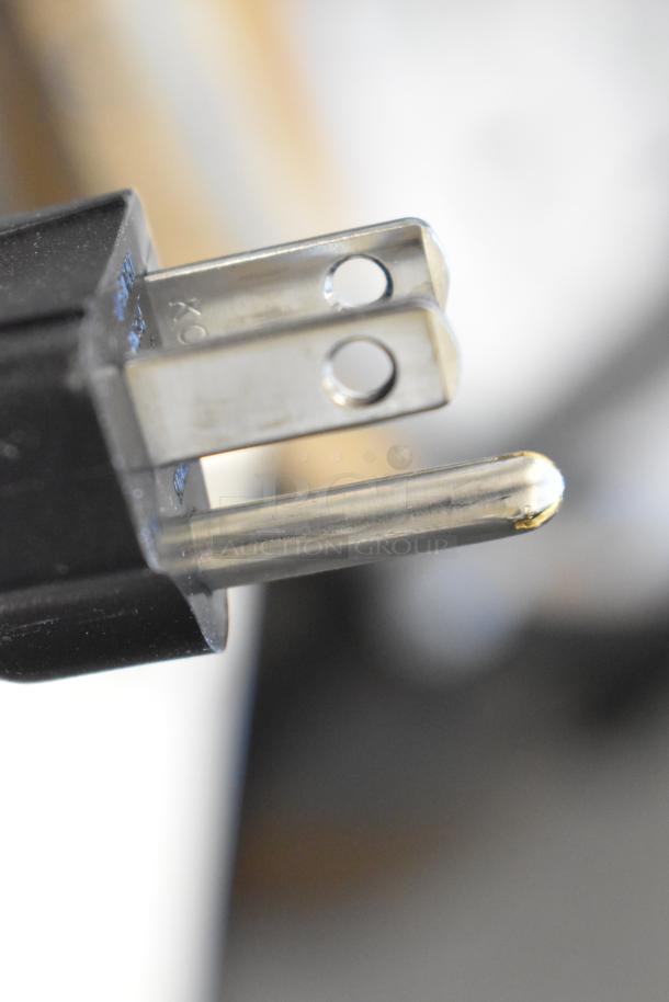 Close-up of a 120V electrical plug. Part of a Bunn VPR-APS Pourover Airpot Coffee Brewer. Brand new, scratch and dent model.