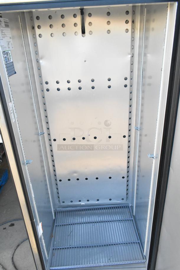 2022 True T-19F-HC stainless steel single-door reach-in freezer, includes poly-coated racks, 115V, 1 phase.