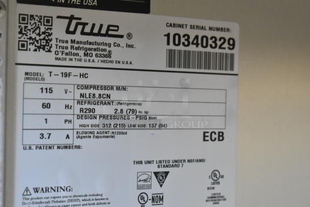 Label for 2022 True T-19F-HC freezer shows model, compressor details, refrigerant type, and compliance certifications.