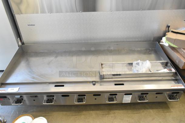 Brand new Wolf 950AGM72N stainless steel natural gas griddle, 162,000 BTU. Countertop model with minor scratches, pristine condition.