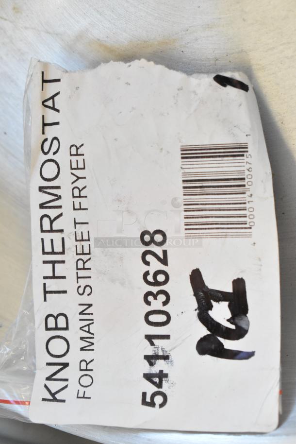 "MainStreet Equipment 541103628 thermostat knob label for floor fryers, white background, bar code visible."