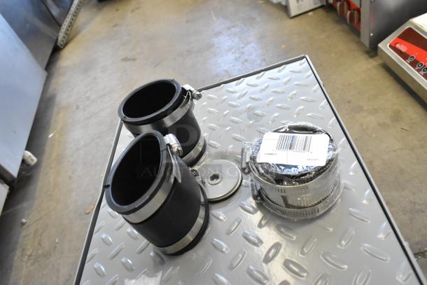 Brand new Zurn GT2700-07-2NH 14 lb. grease trap, 7 GPM, 2" no-hub connections, with visible barcode tag.