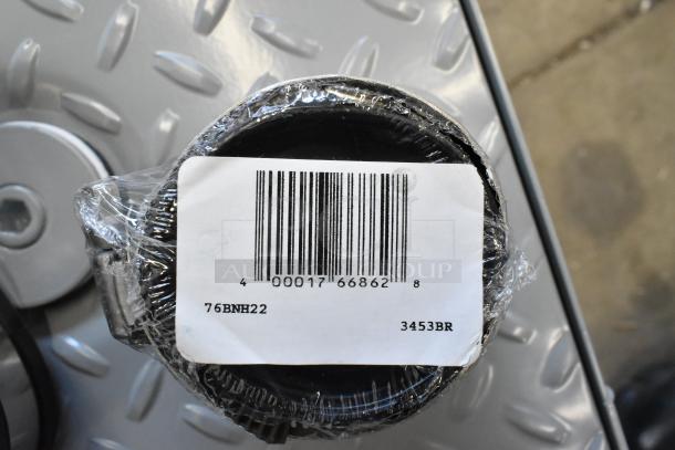 Brand new Zurn GT2700-07-2NH grease trap, 14 lb, 7 GPM, 2" No-Hub Connections, wrapped with barcode visible. Model label: 76BNH22.