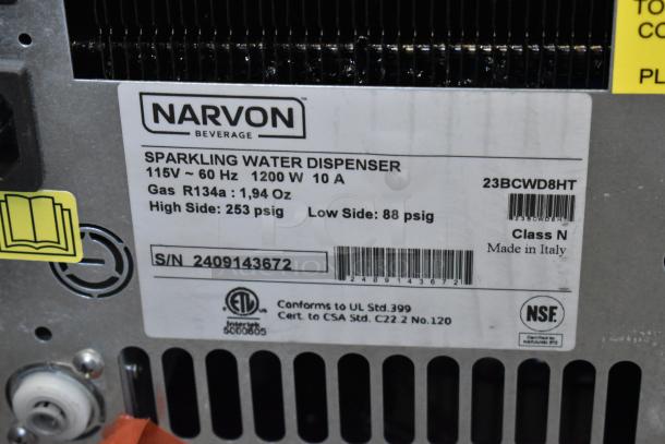 Label on Narvon 23BCWD8HT sparkling water dispenser, showing specs: 115V, 1200W, 10A, R134a gas, made in Italy.