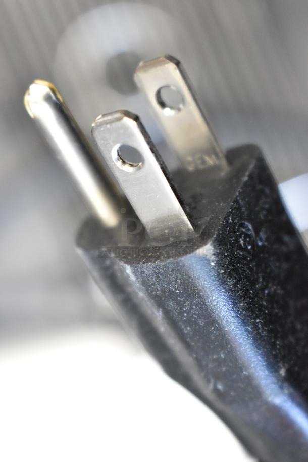 Close-up of a power plug for the 2024 Narvon 23BCWD8HT water dispenser, featuring a three-prong design.