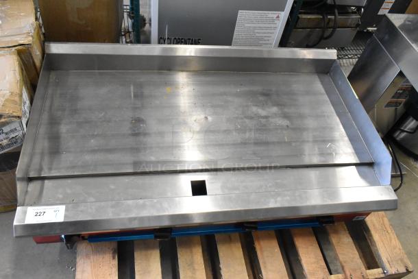 Brand new Avantco 2025 48" gas griddle, model 177CAG48TG, with thermostatic controls. Slight scratches visible.