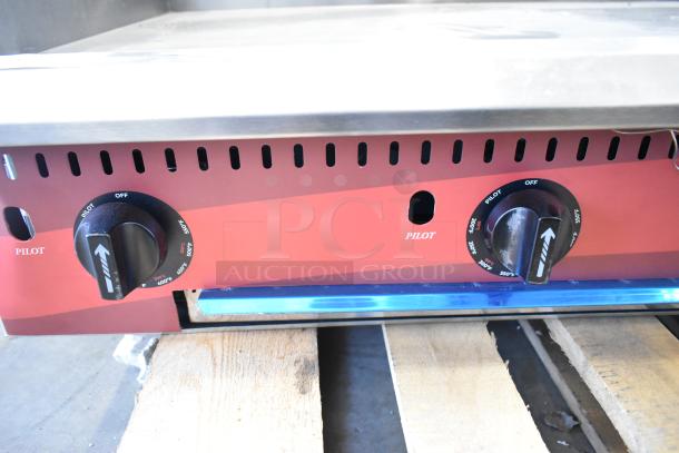 BRAND NEW Avantco 177CAG48TG 48" countertop gas griddle with thermostatic controls, showing pilot settings; scratch and dent condition.