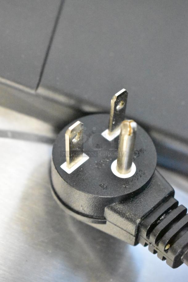 Close-up of the plug for an Avantco 177RCSB90 rice cooker. Shows power connector details.