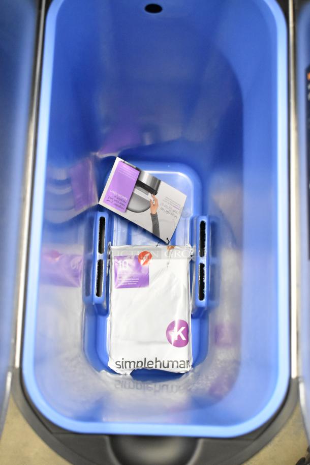 SimpleHuman stainless steel butterfly step can, 12-gallon, brand new with slight imperfections. Includes original packaging.