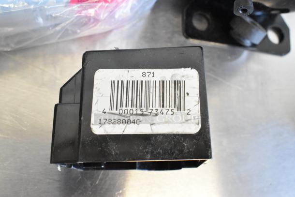 Brand new Cubigel NUT70NR compressor showing barcode label; 115V, 1-phase, minor scratches visible.