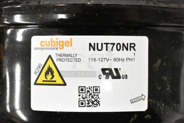 Brand new Cubigel NUT70NR compressor, thermally protected, 115-127V, 60Hz, 1 phase, minor scratches, R290 refrigerant label.