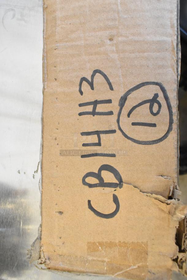 Cardboard box with handwritten markings "CB14H3" and a circled "10." The box has visible wear and tear.