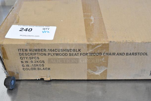 Cardboard box labeled "164CUSHWDBLK" containing black plywood seats for chairs and barstools, quantity 5, new.