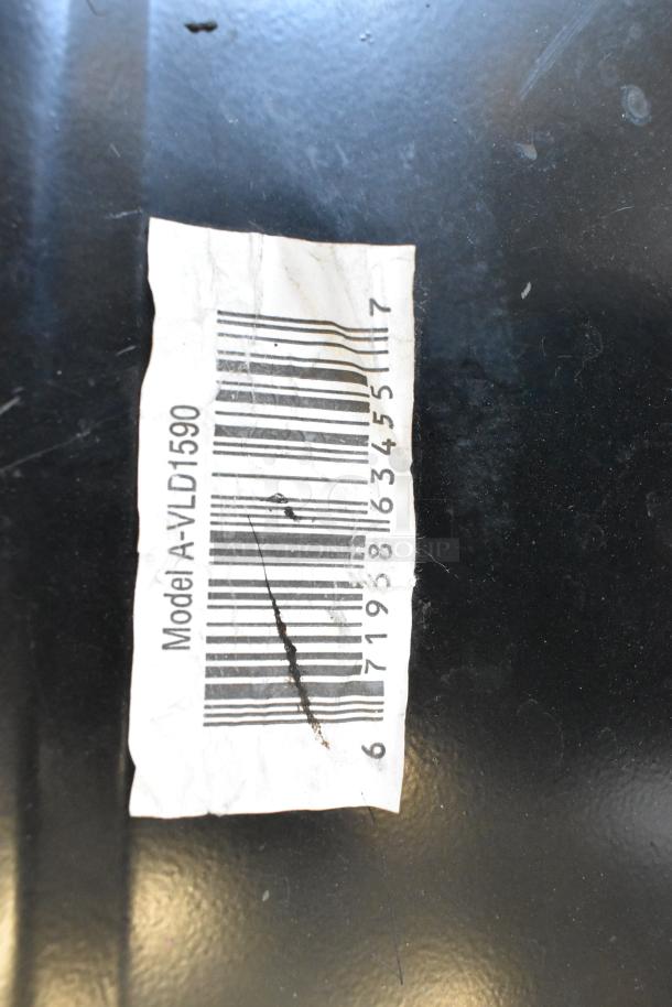 Barcode on forklift seat, model A-VLD1590, showing signs of wear and a visible scratch on the label.