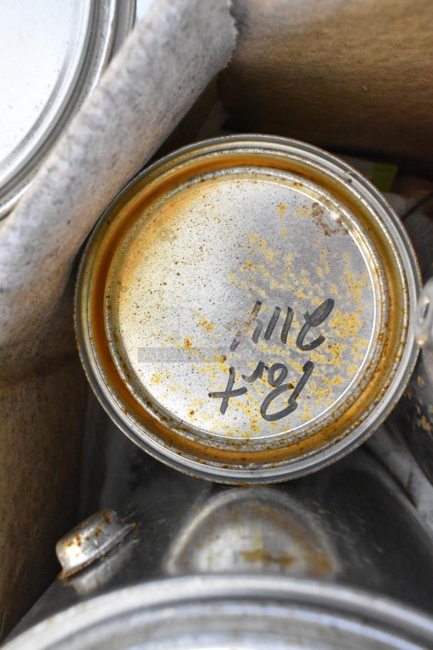 40 cans of Pro Guard Chemicals, with visible wear. Includes Fire Brick Road EPDM Rubber, Trilene. Handwritten markings on lids.