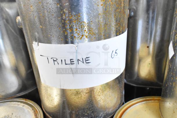 Containers of Pro Guard Chemicals, including labeled Trilene. Visible rust and wear on metal surfaces.