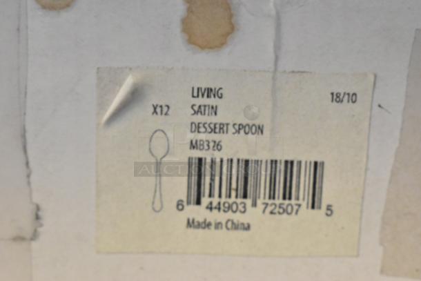 Label reading “LIVING Satin Dessert Spoon, MB326” with barcode and “Made in China” marking.