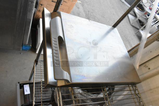 Auction tier lot including various items like dice, serving tongs, metal pieces, commercial casters, and MyZone MZ-3 band.