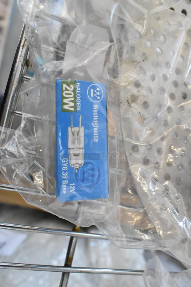 Mixed lot including Westinghouse 20W halogen bulb, commercial casters, serving tongs, metal pieces, MyZone MZ-3 Band.