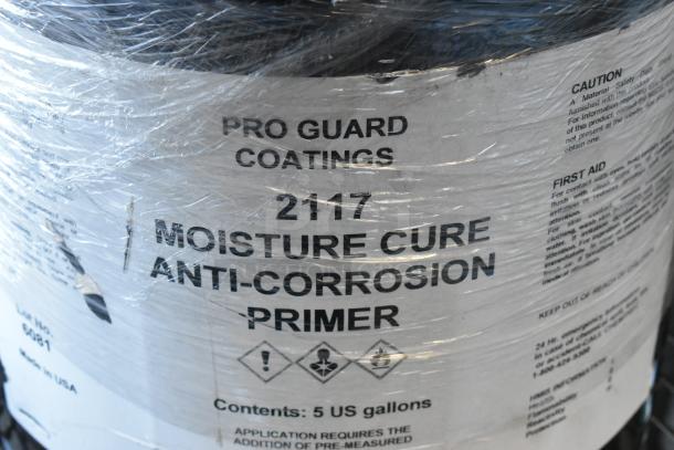 Pro Guard 2117 Moisture Cure Anti-Corrosion Primer, 5-gallon container. Well-labeled, includes safety and usage instructions.