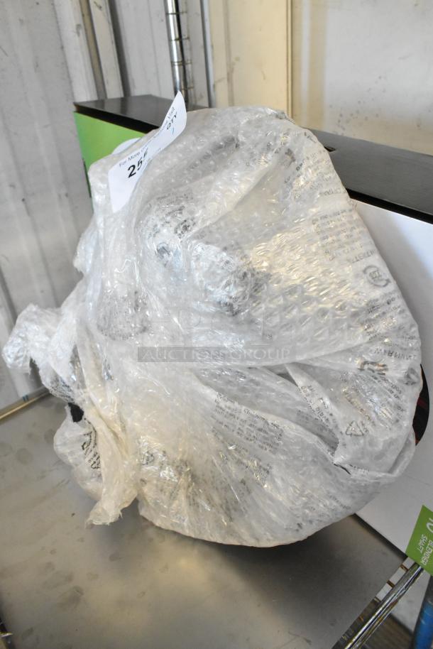 Knife Removal Tool wrapped in bubble wrap, partially visible on a shelf, labeled "257". Condition unknown.