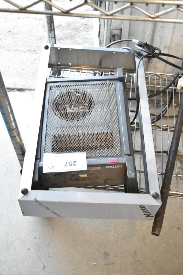 Patton PUH9907HD Room Heater, 120 Volts, 1 Phase, on metal rack, visible controls and label indicating model and info.