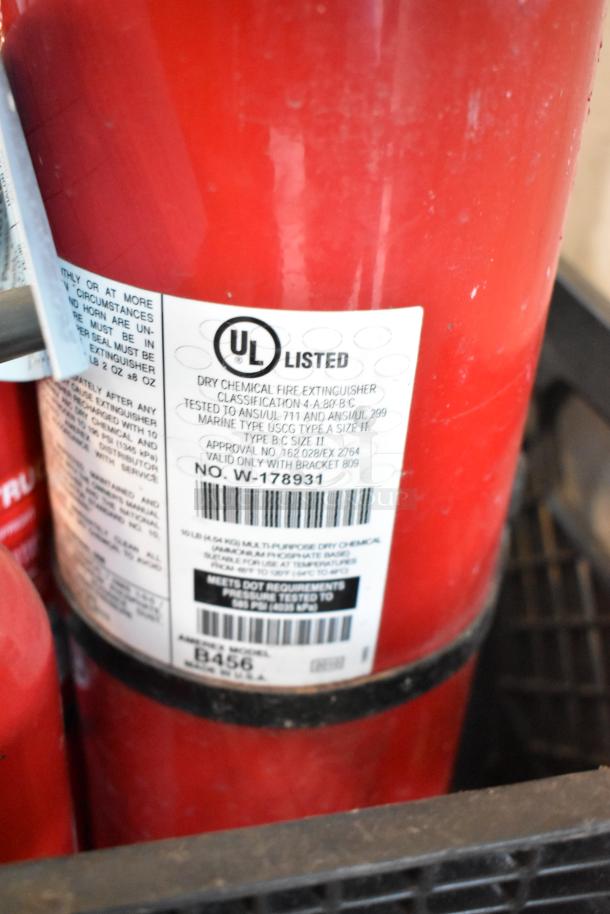 Red dry chemical fire extinguisher showing UL Listed label, model B456; 5 extinguisher lot, buyer pick-up required.