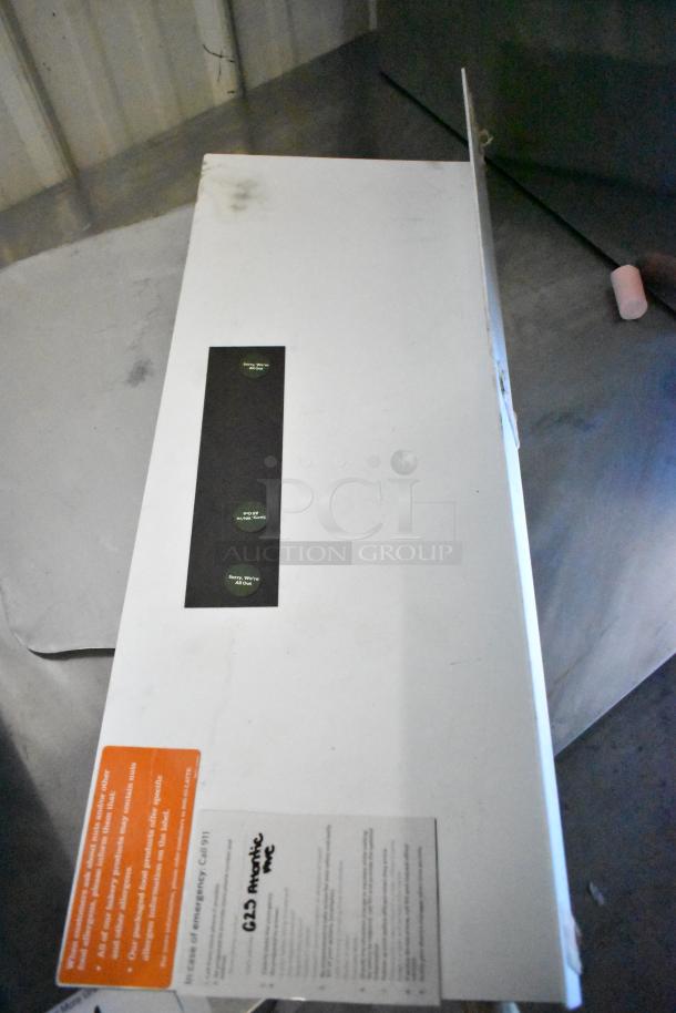 Box labeled "629 Atlantic Ave" containing 8 items, including metal pizza peel and serving trays. Sealed with safety and handling labels.