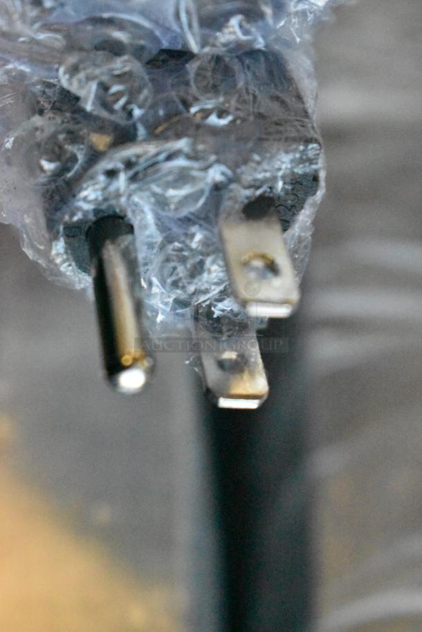 Close-up of a wrapped plug from the Avantco 177FFDS1 French Fry Warmer. Shows the power connection detail.